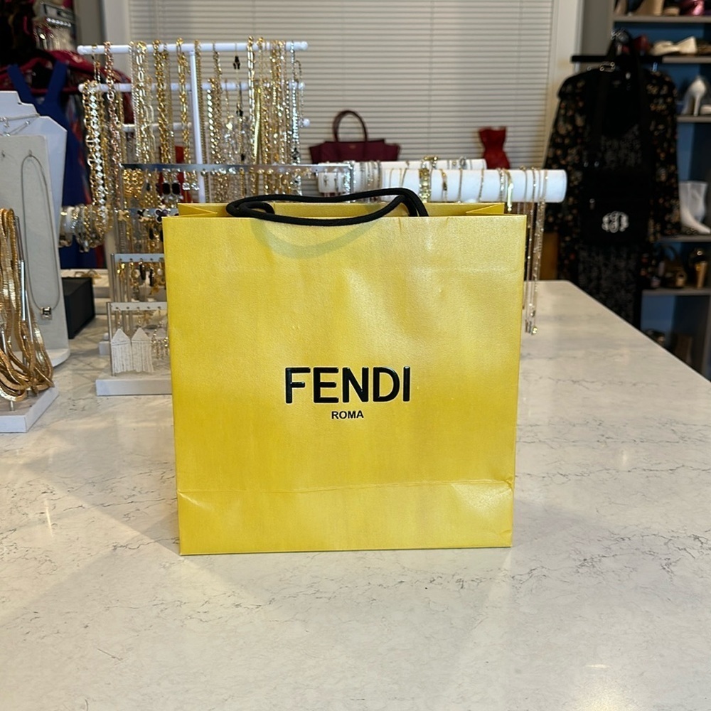 Fendi yellow gift bag with black ribbon